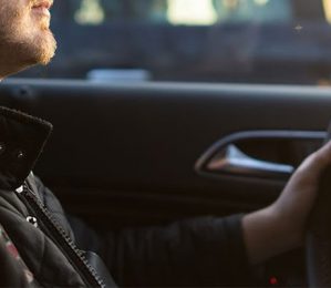 man driving a car
