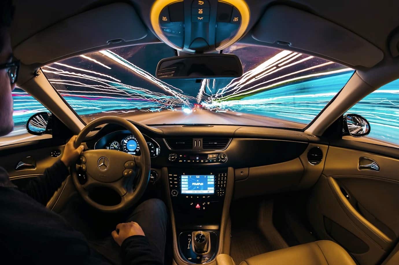 time-lapse photography of man riding car
