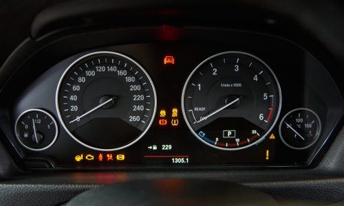 car dashboard with signs and symbols fuel speed scaled