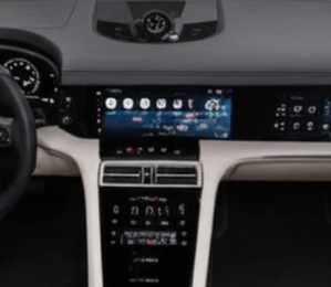 The interior of a modern Porsche, showcasing its sleek dashboard design with multiple digital displays.